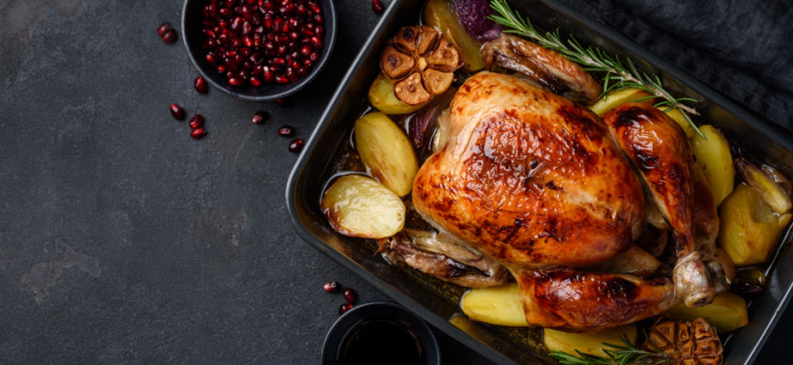 Roasted,Chicken,In,Pomegranate,Sauce,With,Potatoes,In,A,Gray