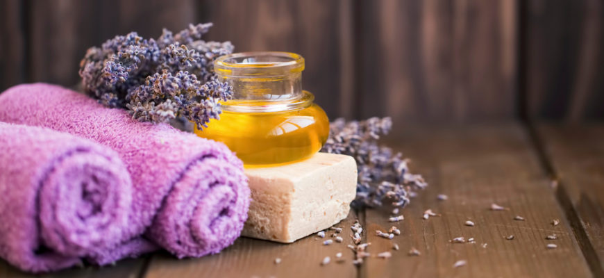 Lavender,Oil,,Towels,,Natural,Soap,And,Lavender,Flowers,On,Wooden